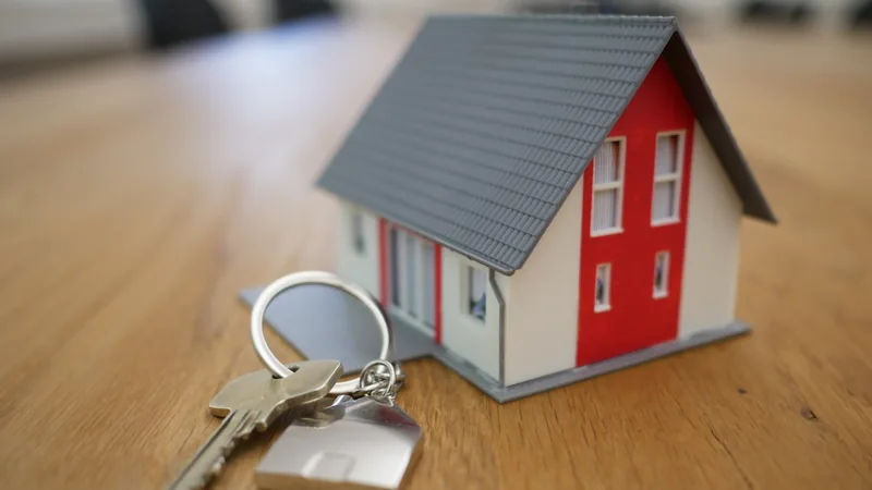 A model house beside a set of keys